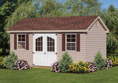 Beige Cottage Style Shed with Flower Beds and Landscaping