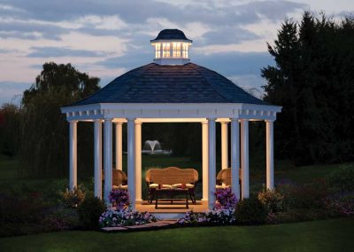 Amish-Built Bell Roof with lights on Pavilion at Dusk