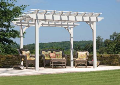 Landscape Pergola Above Outdoor Seating with Wicker Furniture